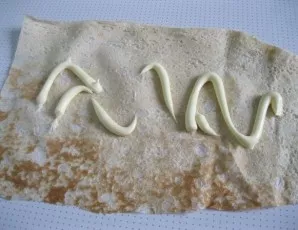 Spread a little mayonnaise on the lavash patty.