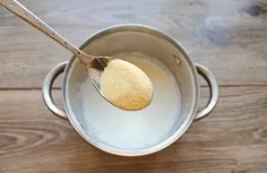 Bring the milk to a boil over medium heat. While stirring the milk, add semolina in a thin stream. Continue stirring until all the semoli...