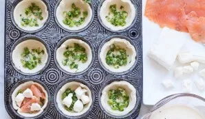 Form the sides with your hands, stuff each form with fried onions and parsley, then add the fish, cream cheese and pour in the cream (dis...