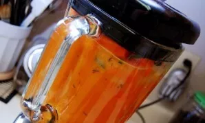 Then transfer the vegetables to a blender. Add lemon juice, salt and pepper. Crush the ingredients into a puree.