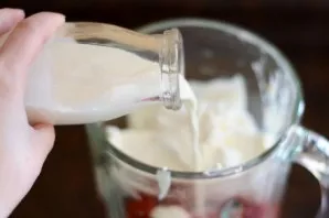 Pour medium-fat cream into a blender.