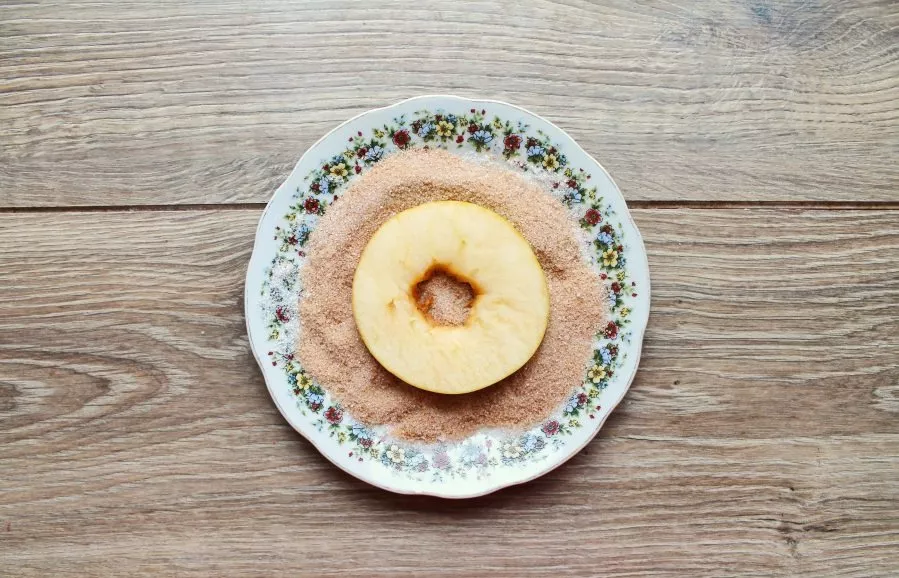 Mix sugar and cinnamon. Dip the apple rings into it from both sides.