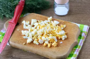 Hard-boiled eggs, cool, peel and cut into slugs.