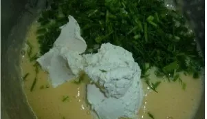 In a bowl, mix the beaten egg with cheese, onion letters and mayonnaise. Add flour, salt and pepper. You can also add other spices, for e...