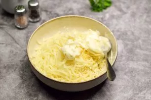 Add mayonnaise, chopped garlic cloves, salt and pepper to taste.