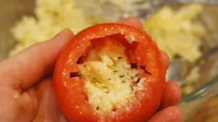 Stuff the tomatoes with cheese mixture.
