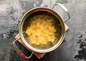 Pour clean water into the pot and bring to a boil. Wash the potatoes, peel them, cut into small pieces, put in boiling water and cook for...