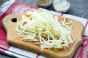 Cut the cabbage into strips with a sharp knife or use a cabbage grater.
