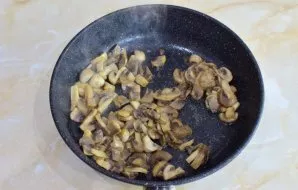 Wash the champignons to remove dirt and cut into slices. Fry them with vegetable oil. Add a little salt.