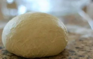 Leave the dough in this form for 20 minutes, covered with a towel, in a warm place. Then put on a working surface sprinkled with flour an...