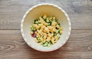 Cut the cheese into cubes and place in a bowl.