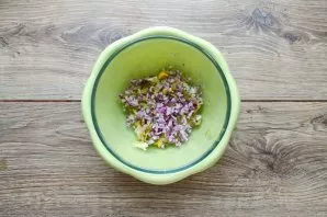 Finely chop the red onion and add to the salad.