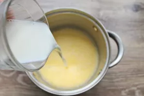 Dissolve the starch in milk and pour it into a pot with eggs and condensed milk. Mix everything until smooth. Put it on, bring it to a bo...