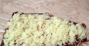 Grate potatoes on top of the fish.