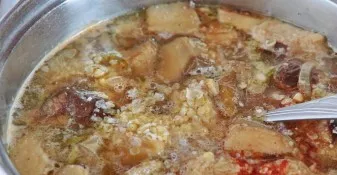 Transfer all the contents of the pan to a saucepan and pour water. Then put on the stove and bring the soup to a boil. Add grits. Cook un...