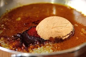 Add brown sugar to the pan and mix everything thoroughly.