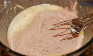 Add the dry mixture (flour, cocoa powder, soda, baking powder, coffee, cinnamon and salt) to the liquid mixture.