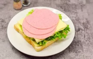 Then add half the cheese and half the sausage.