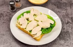 Put a salad and sliced chicken breast on top of the sauce.