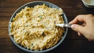 Grease the baking sheet with butter or line it with baking paper. We put the filling, evenly distribute it, sprinkle it with the remainin...