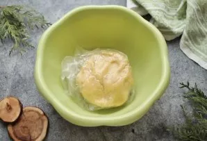 Add yolk and sour cream to the flour crumbs. Quickly knead the soft dough, collect in a ball, put in a bag and put in the refrigerator fo...