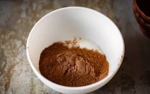 In a bowl, mix the sugar and cocoa.