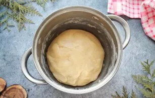 Sift the flour and add in parts to the mixture, kneading until smooth dough. Cover and let stand for 20 minutes.