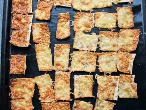 Cut the lavash into pieces and place in a baking sheet. Put the baking sheet in a hot oven and bake the chips at a temperature of 180 deg...