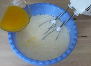 Melt the butter, pour it into a bowl. Continue mixing on low speed.