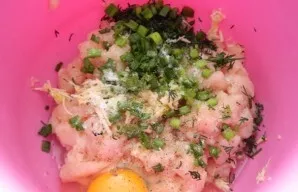 Then break an egg into the chopped meat, add herbs, garlic, salt and pepper to taste.