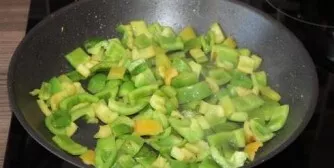 Add a little oil to the pan and add the bell pepper cut into pieces. The pieces are about the same size as the pieces of chicken fillet. ...