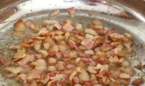 Add bacon and fry until golden brown.