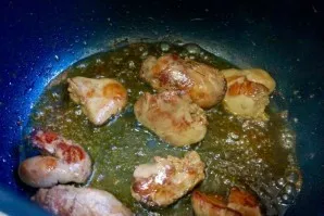 Fry the pieces of liver in the same oil until golden brown.