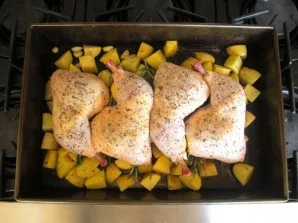 Put the chicken on top of the potatoes. Bake until golden brown for about 45 minutes at a temperature of 200-220 degrees.