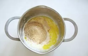 Pour breadcrumbs into cream.
