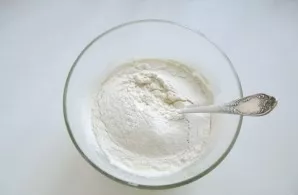 Gradually add the sifted flour.