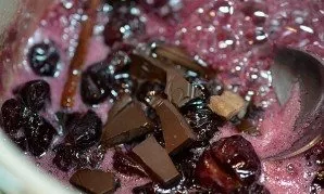 Add broken chocolate. Stir and remove from heat.