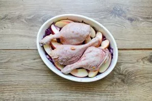 Put the duck legs on top and pour the marinade.