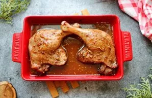 Put the duck in a baking dish, pour it with marinade and cover with foil. Place in a hot oven and bake at a temperature of 180 degrees fo...