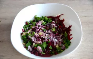 Cover the beets with salad dressing, add chopped onions and parsley leaves.