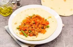 Put the prepared filling on top of the tortillas, wrap and strengthen with a spit. Burritos can be served, and can also be additionally f...