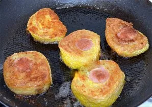 Dip each piece in an egg and put in a pan with heated vegetable oil. Fry over medium heat until golden brown, then dry on a paper towel t...