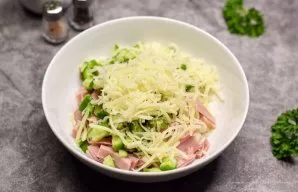 Grate the hard cheese on a medium or fine grater and add to the salad.