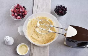 Stir in the flour at low speed. Add condensed milk and mix carefully.
