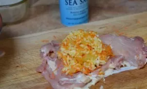 Place the filling on a piece of chicken (the skin should remain outside).