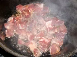 Put the meat in hot oil.