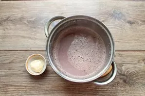 Put cocoa on medium heat and bring to a boil. Pour in the condensed milk, stir until smooth and bring to a boil again, remove from heat.