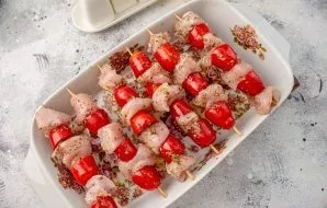 Roll the pickled pieces of turkey meat on skewers, alternating with cherry tomatoes. Put in the correct form, as in the photo, so that ju...
