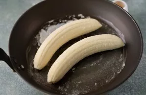 Add the bananas to the butter, reduce the heat, otherwise the butter will burn.