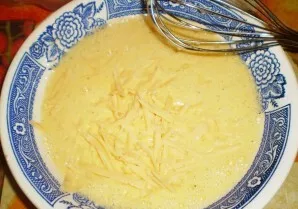 Gradually add flour and beat until thick sour cream. At the end, add the grated cheese and mix until smooth.